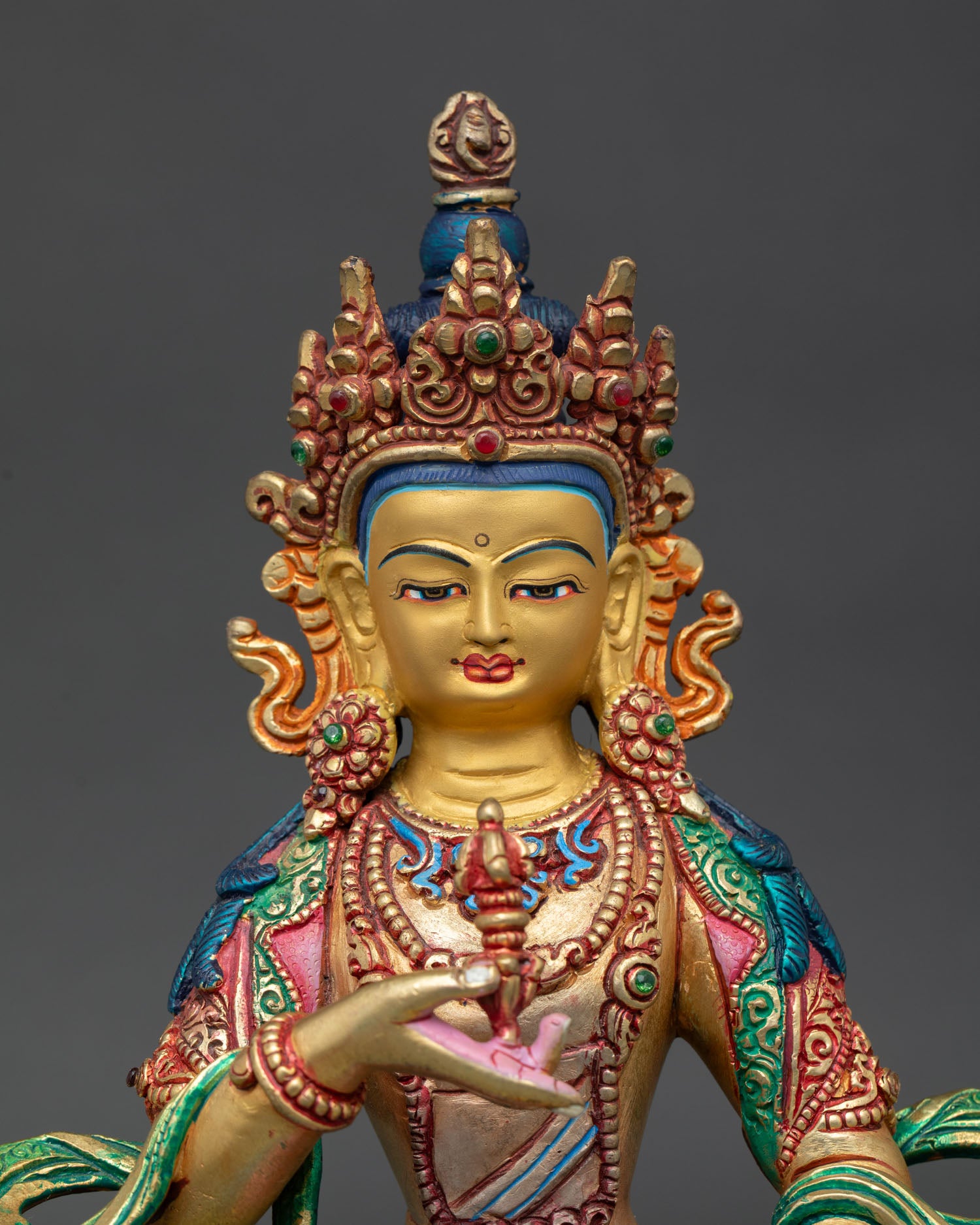 Close up Vajrasattva serene gold painted face with enlightened expression symbolizing purification spiritual renewal and divine wisdom