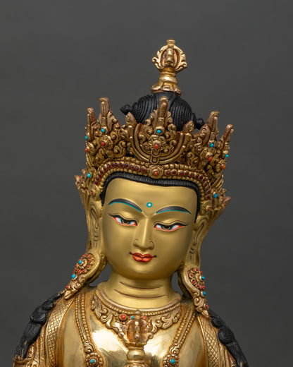 Close up of Vajrasattva statue showing gold gilding and semi-precious stones