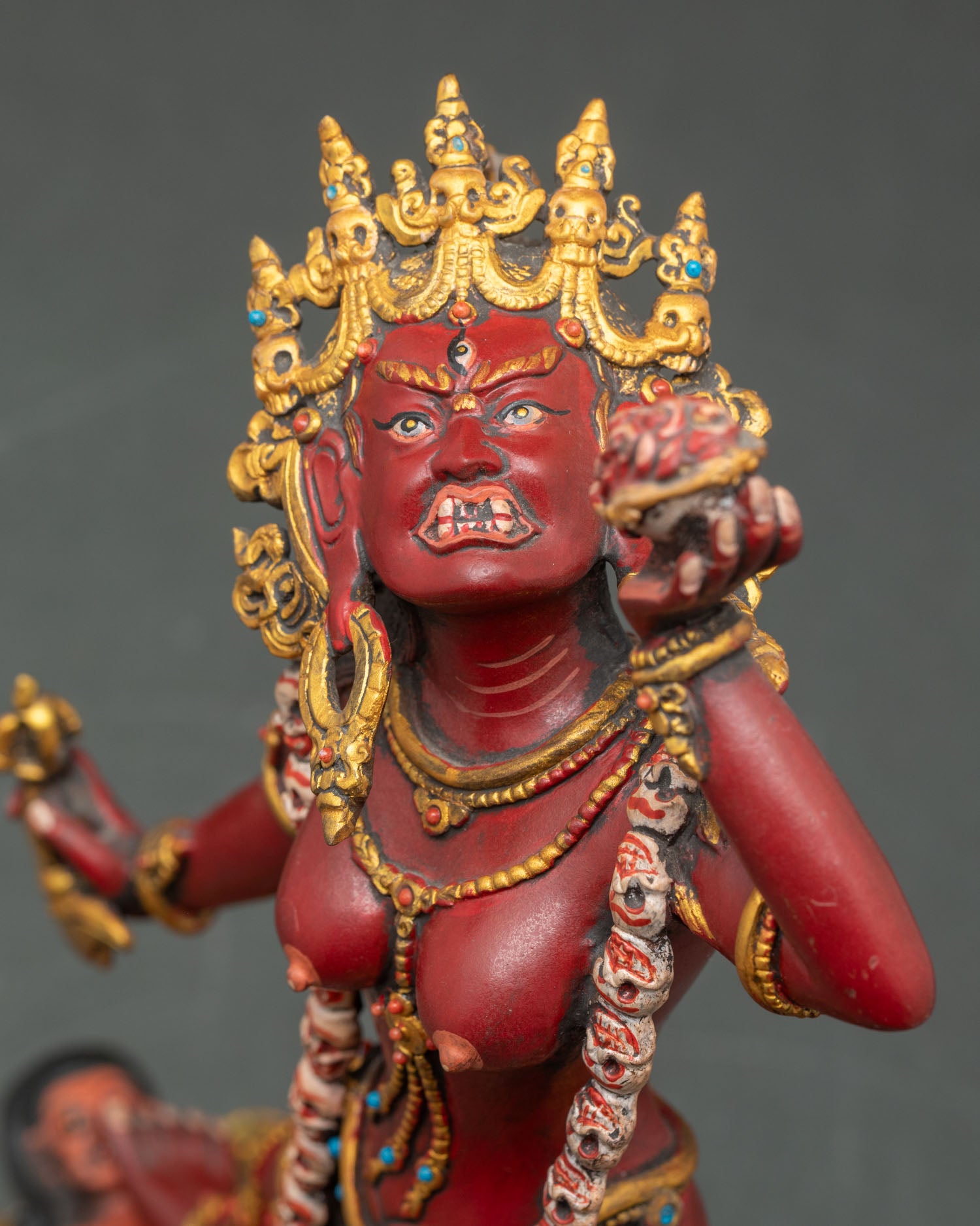 Close up Vajrayogini five skull crown semi-precious stones intricate detail
