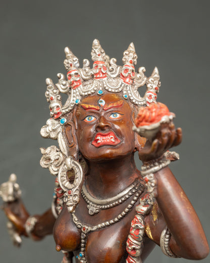 Close-up Vajrayogini statue, dynamic posture, intricate carvings, Tibetan deity