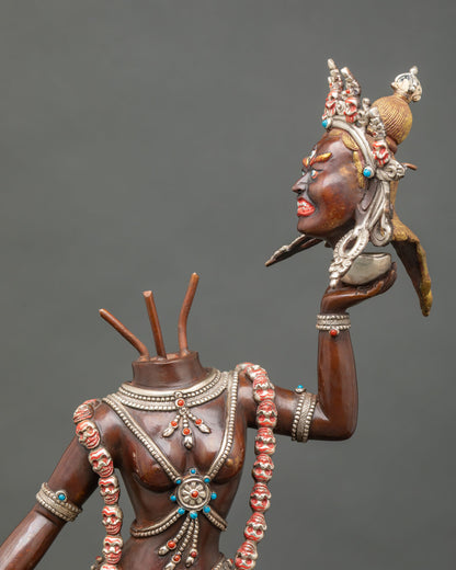 Close up Vajrayogini Ucheyema statue severed head skull cup bone ornaments coral turquoise stones