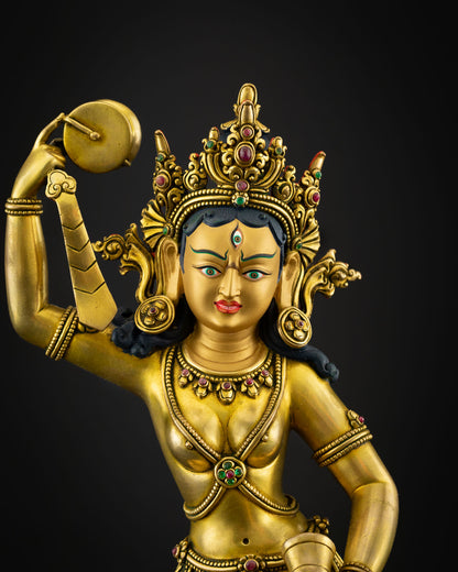 Close up view Machig Labdron face with gold painted expression intricate crown and sacred jewelry symbolizing compassion wisdom and enlightened feminine energy