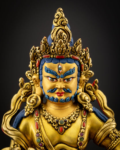 Close up view of Namtoshe face with fierce expression, third eye and five jeweled crown in gold gilded finish symbolizing protection wealth and spiritual power