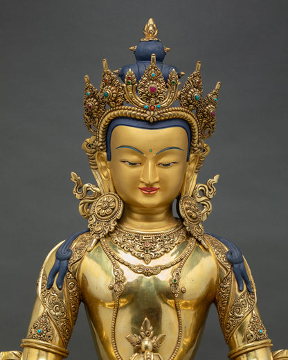 close up view of amitayus statue showing kalasha vase, gold gilded ornaments and fine detailing