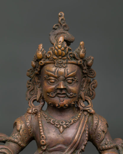 Close up view of Dzambhala statue face ornaments and intricate handcrafted details by Nepalese artisans.