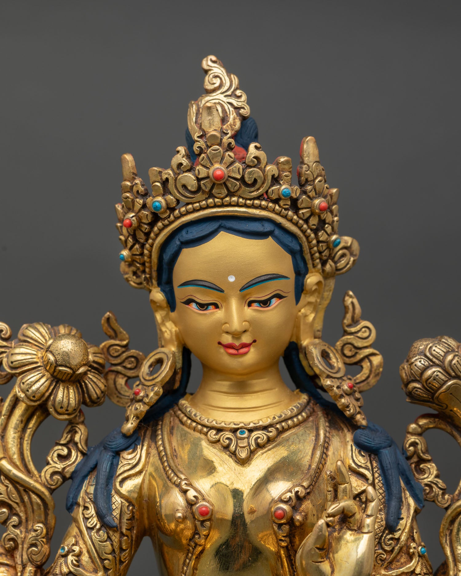 Close up view of Green Tara sculpture showing ornate crown, semi precious stone jewelry, and finely detailed Nepalese Newari craftsmanship