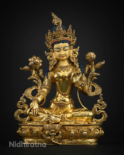 Close Up View of Green Tara statue face with serene expression and sacred details
