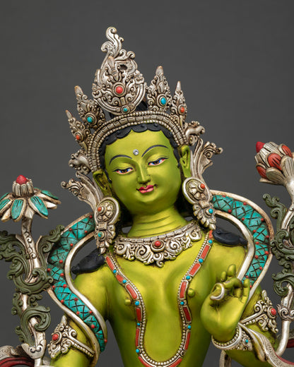 Close up view of Green Tara Statue showing intricate 3D hand carving silver plated ornaments and symbolic green details