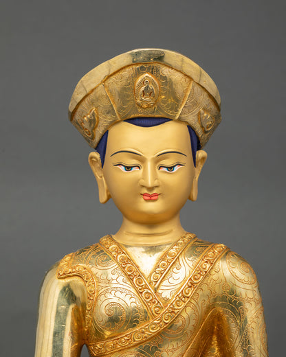 Close up view of Jigten Sumgon sculpture showing serene facial expression, intricate crown detailing, and Himalayan Newari metal craftsmanship