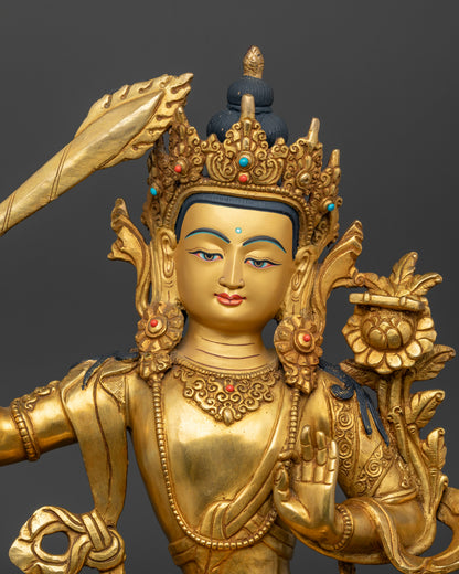 Close up view of Manjushri Statue showing gold details and Nepalese handcrafted artwork