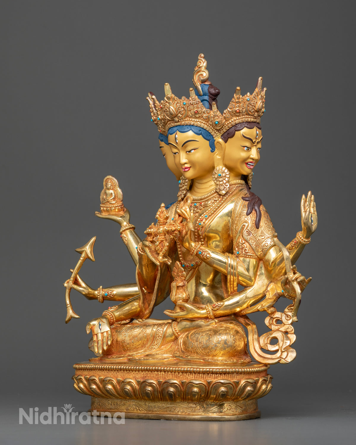 Close up view of Namgyalma statue with gold painted face and intricate Nepalese carvings