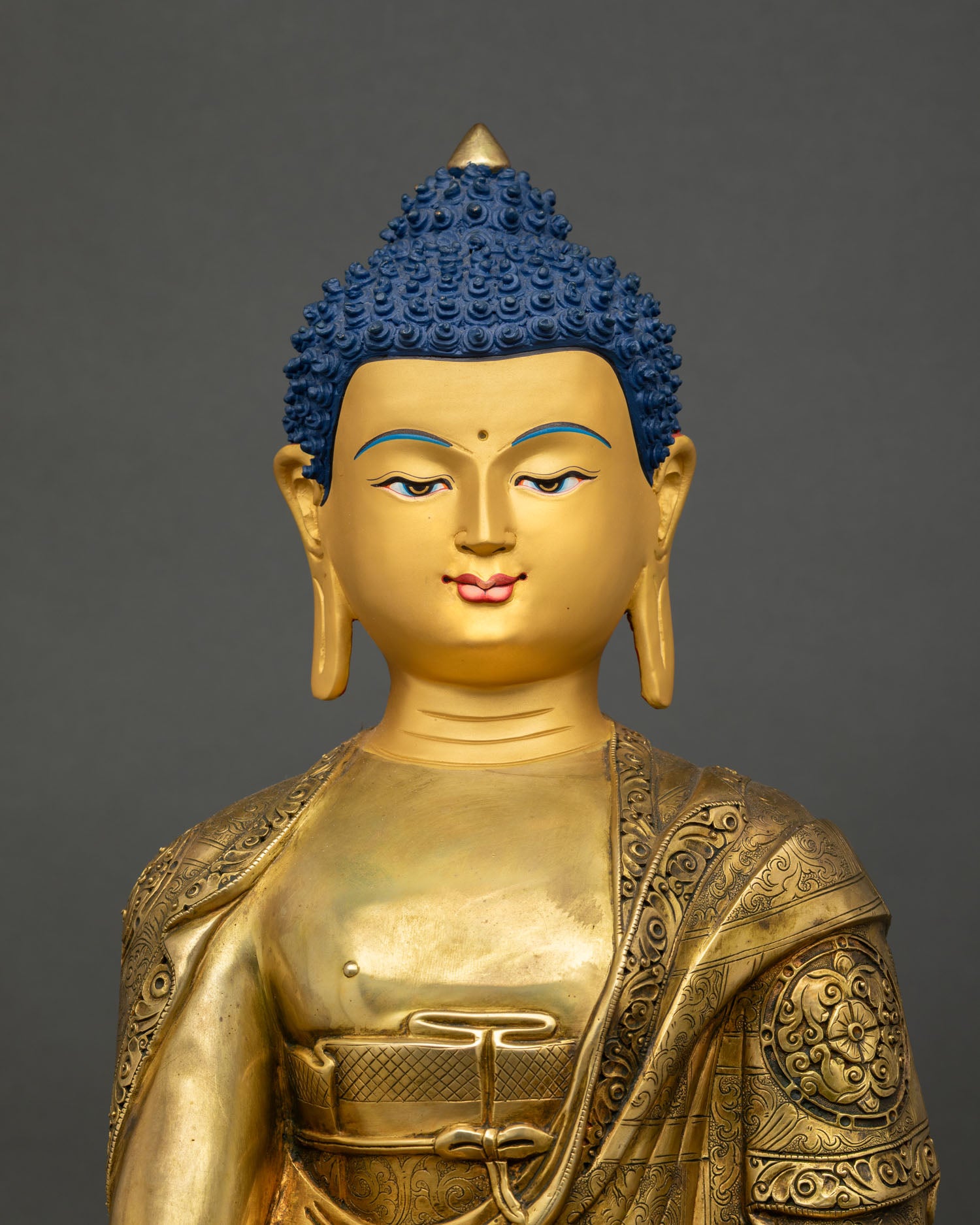 Close Up View of Shakyamuni Buddha Statue Serene Expression and Intricate Details