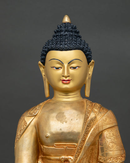 close up view of shakyamuni buddha statue with intricate gold details
