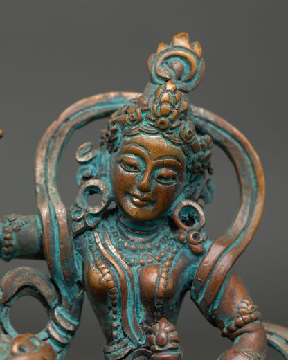 close up view of tseringma buddhist statue showing detailed antique craftsmanship