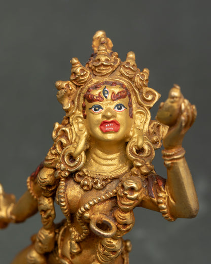Close up view of Vajrayogini Statue gold painted face kartika knife and skull cup.