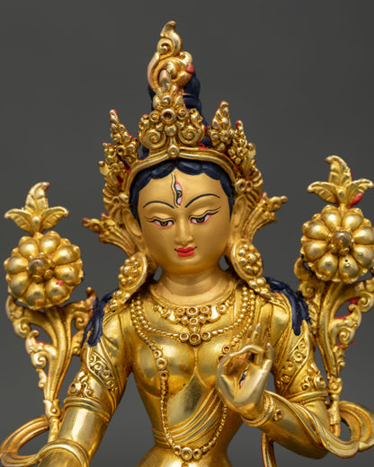 Close up view of White Tara Buddhist goddess statue, showing compassionate facial details
