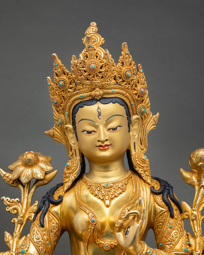 Close up view of White Tara goddess statue showing gold toned serene face Himalayan craftsmanship