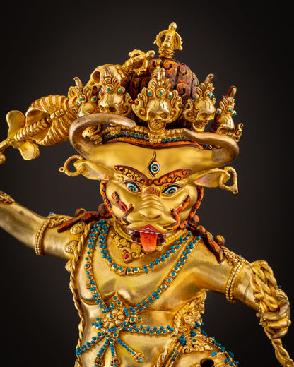 Close up view of Yamantaka with gold painted face 24K gold gilded copper Vajrayana deity sculpture with semi precious stones.