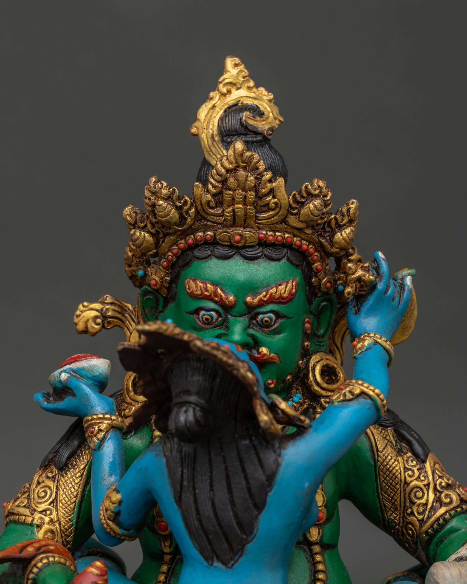 close-up view shows the intricate details of the Jangku Dzambhala Yab-Yum statue