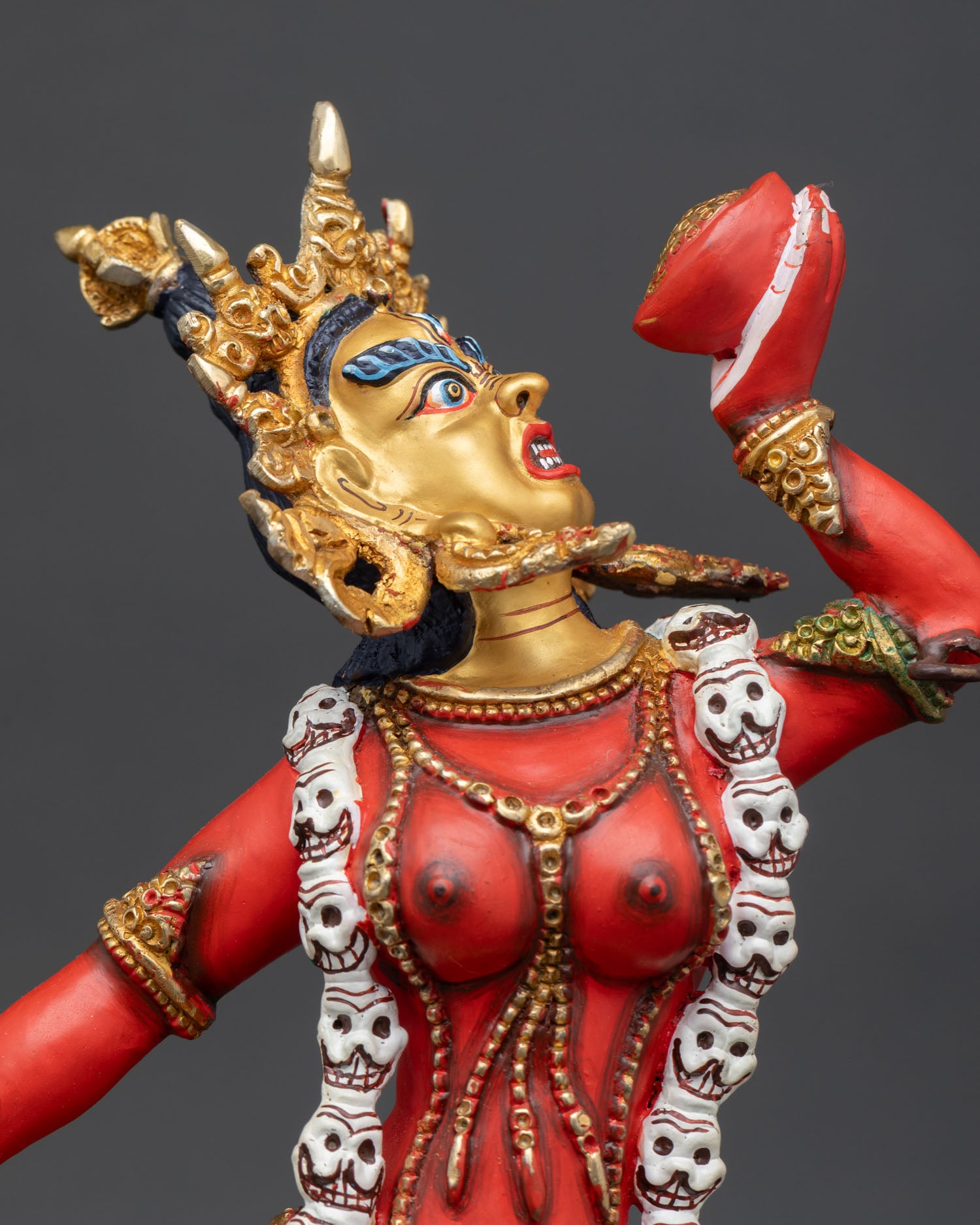 close up view Vajrayogini statue intricate copper details gold gilded tantric goddess sculpture