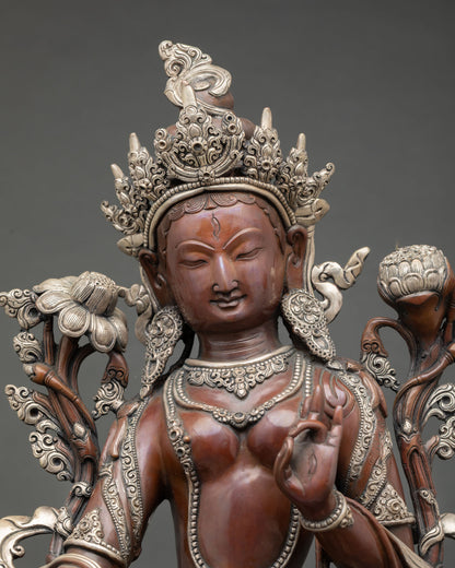 Close up view White Tara face with seven all seeing eyes symbolizing compassion healing wisdom and longevity in Himalayan Buddhist sculpture