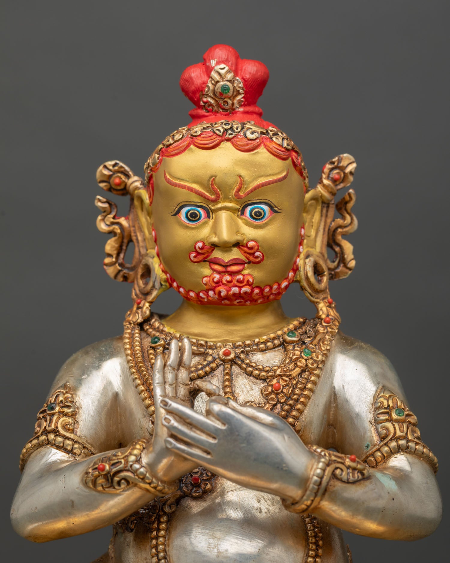 Close up Virupa face gold painted finish semi precious stones and detailed Kathmandu craftsmanship