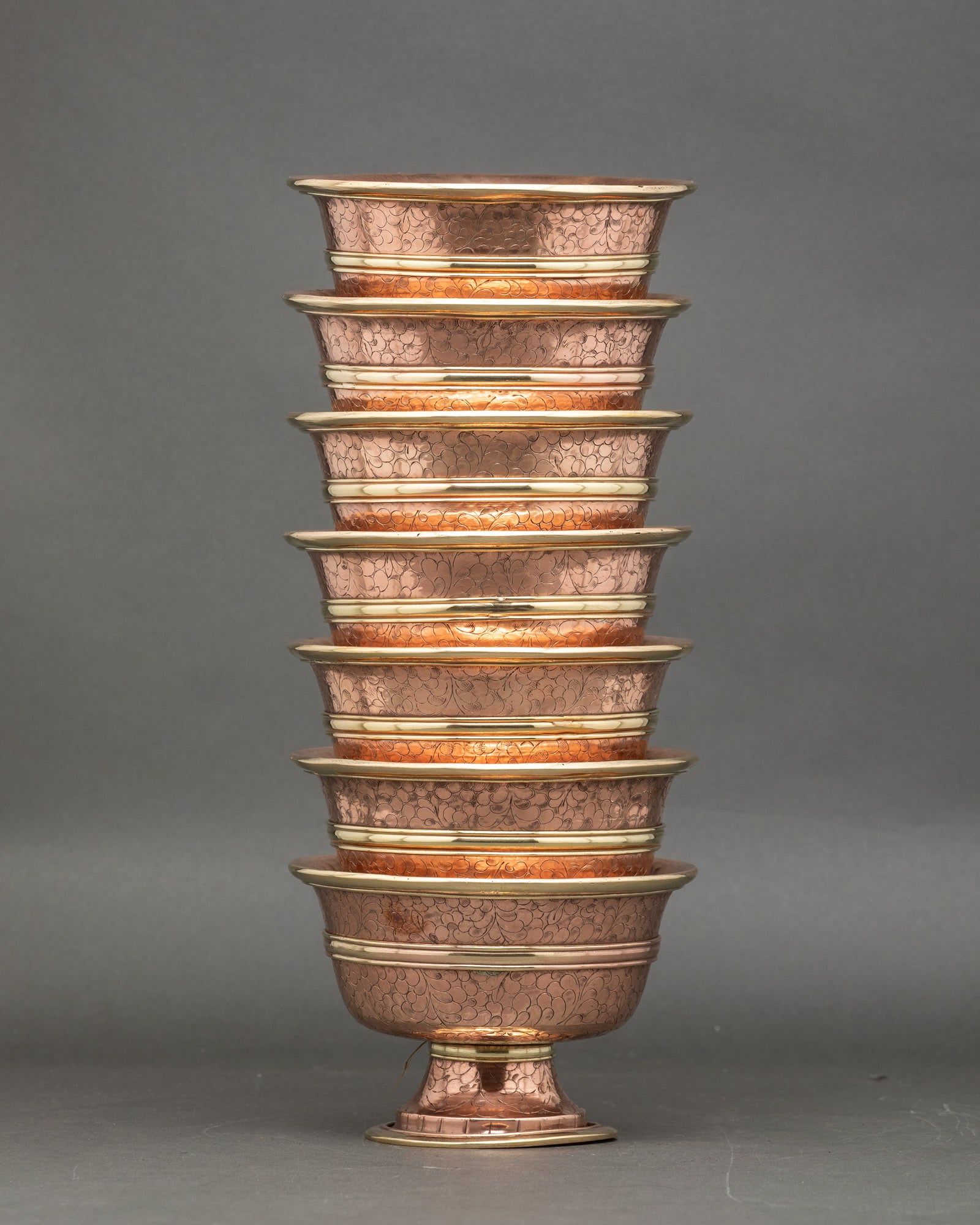 Close-up water offering set, copper, handcrafted Tibetan ritual bowls