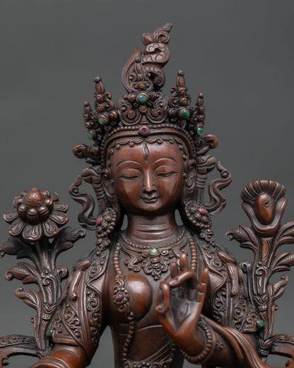 close up white tara face calm expression oxidized copper himalayan spiritual statue seven eyes detail