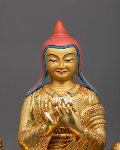 close-up of Atisa statue showing intricate carvings and calm expression on gold-gilded face