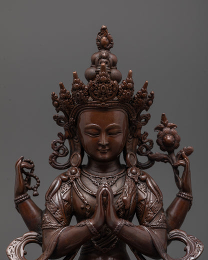 Close-up of Chenrezig statue highlighting intricate machine-crafted details and dark tone