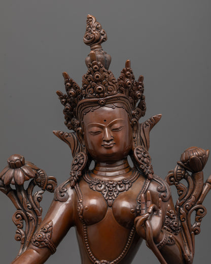 close-up of oxidized green tara face showing lost wax casting and artisan craftsmanship