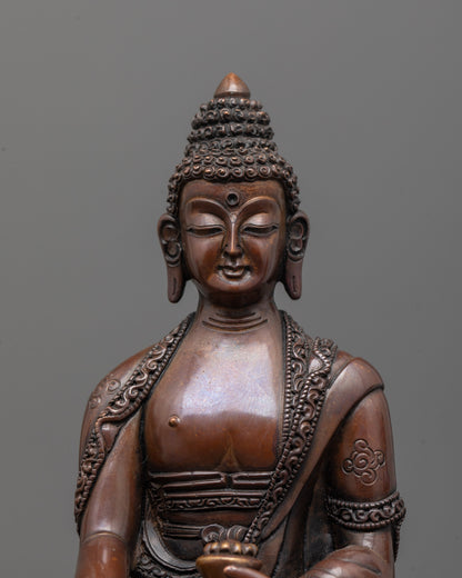 close-up of shakyamuni buddha statue face with halo and intricate lost wax casting details