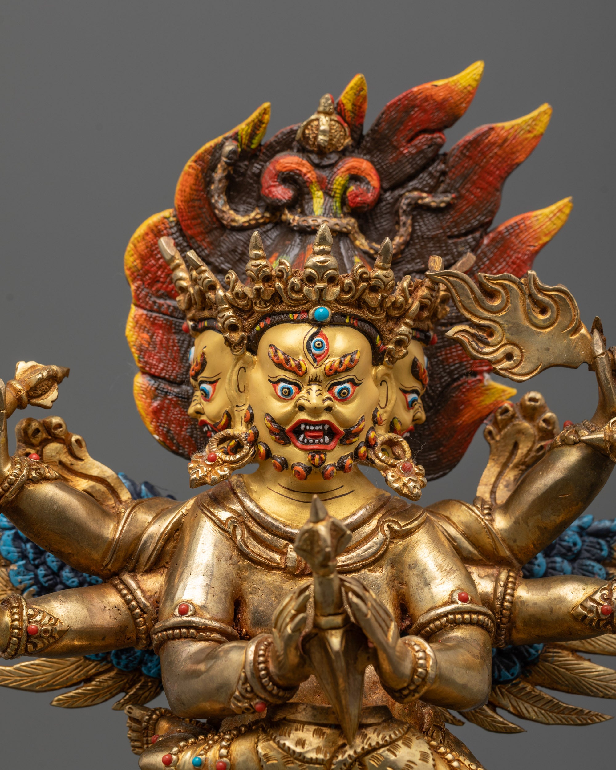 close-up of vajrakilaya statue showing intricate carvings and semi-precious stone details
