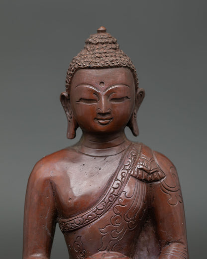 Close view of Amitabha Buddha sculpture showing detailed monk robe carving serene expression and antique copper texture.
