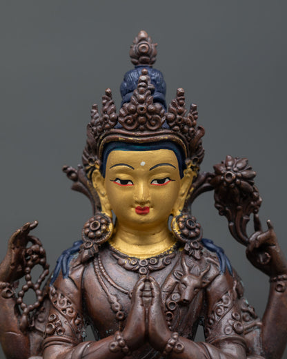 Close view of Chenrezig Bodhisattva face showing 24k gold painted details and intricate Himalayan craftsmanship.