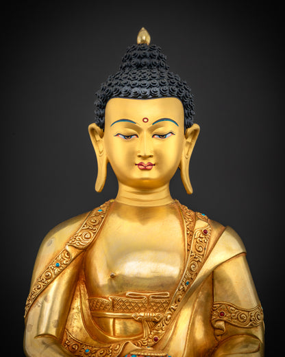 close up Amitabha Buddha statue fine detailing gold-painted face Nepalese artisan craftsmanship
