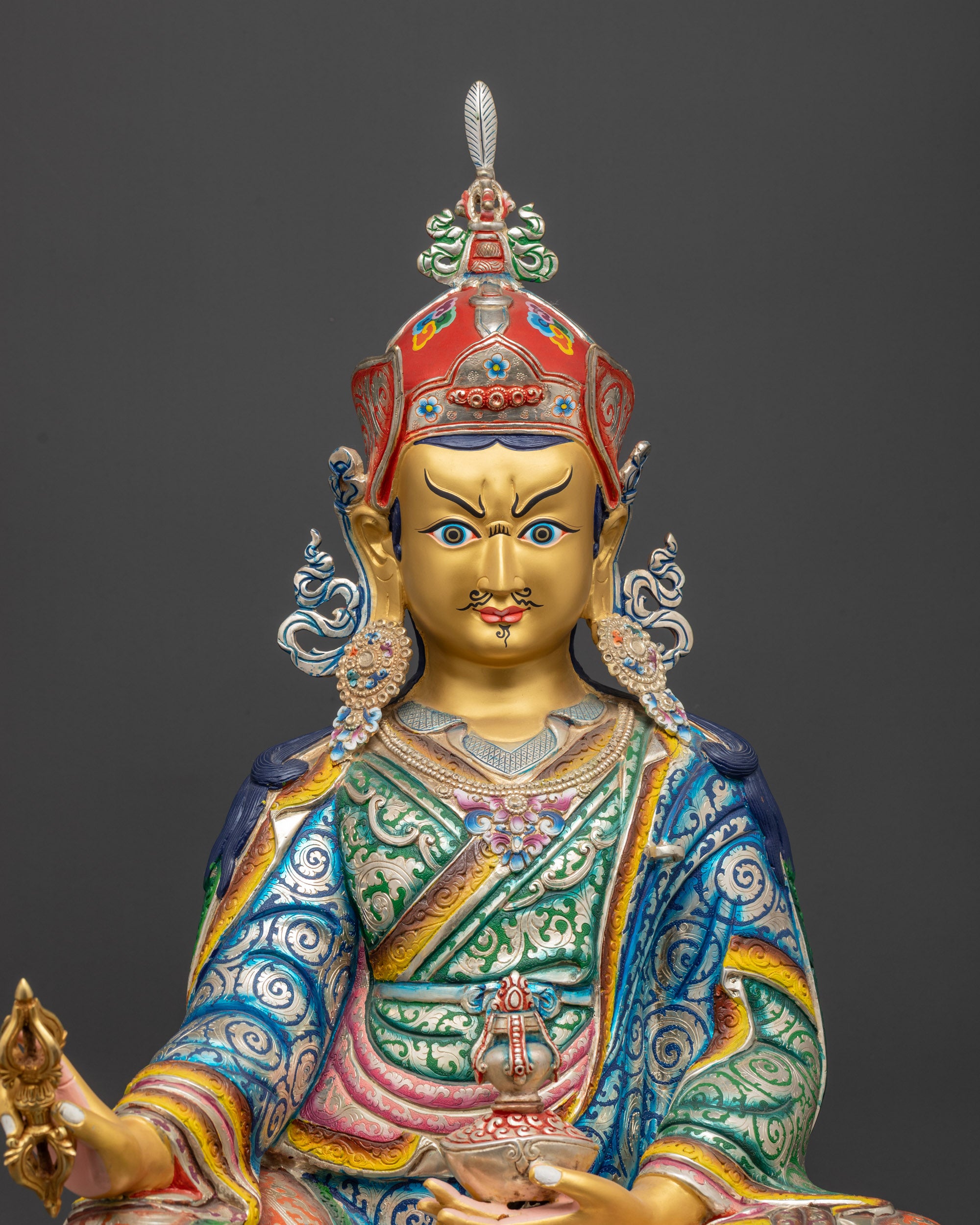 close up Guru Padmasambhava Statue showing skull cup vajra and hand-painted kasaya robe