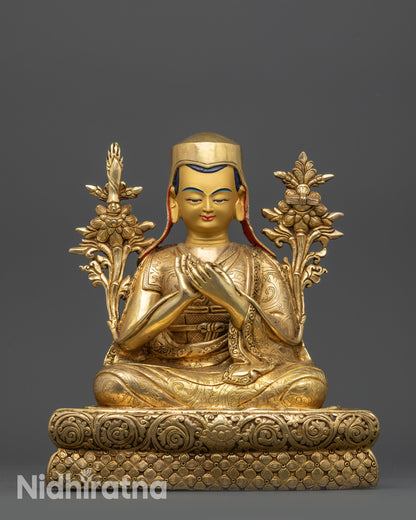 close up Sachen Kunga Nyingpo and Sakya Pandita statues gold gilded faces and robes
