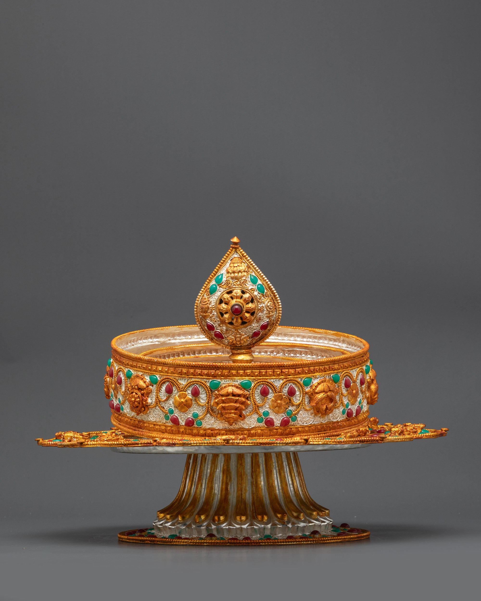 close up Sacred Tibetan Mandala showing detailed floral patterns with semi-precious stones
