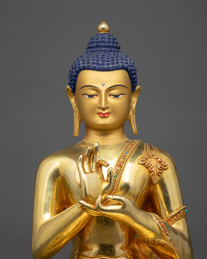 close up Suvarna Bhadra Vimala statue Dharmachakra mudra and polished lotus base
