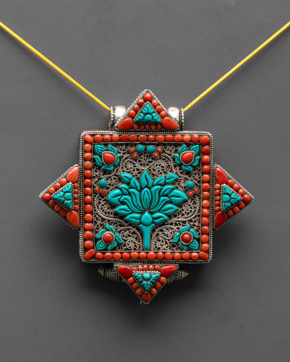 close up Tibetan lotus locket showing intricate silver filigree and sacred lotus flower symbol