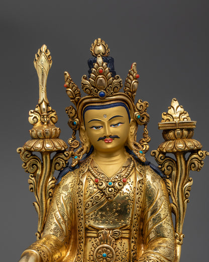 close up Trisong Detsen statue showing detailed jewelry, robe motifs, and serene expression
