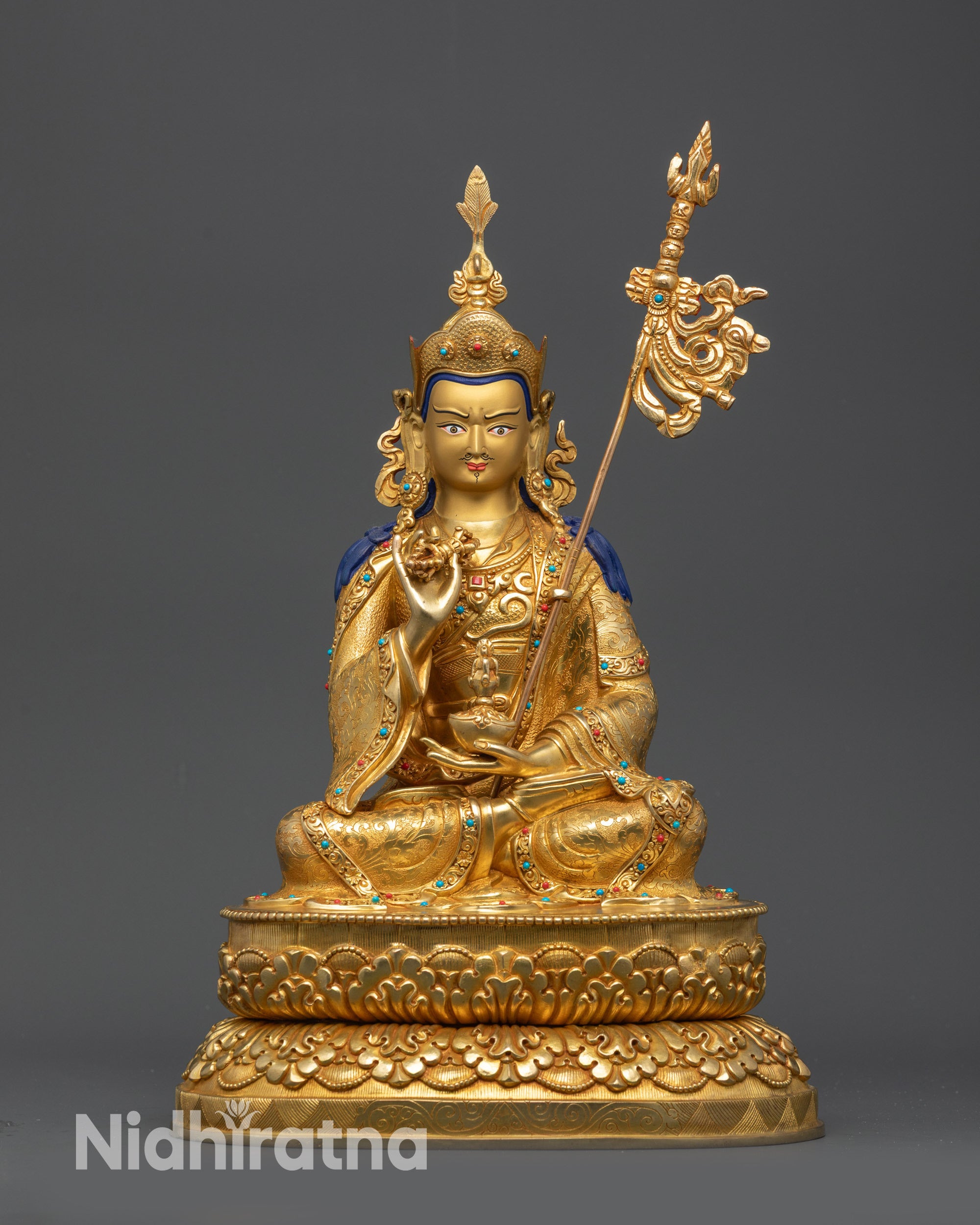 close up Tsokye Dorje gold-gilded face lotus hat vajra skull cup khatvanga statue