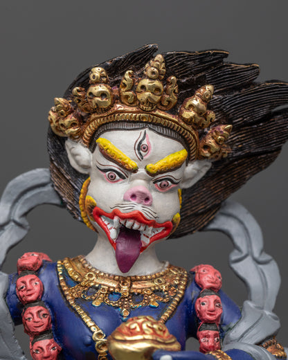 close up of Simhamukha Dakini face showing wrathful expression and third eye
