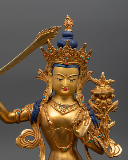 close up of manjushri statue crown robe and semi-precious stone details in fine craftsmanship