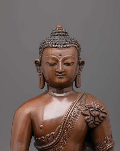 close up of oxidized copper face showing serene expression of Gautama Buddha statue