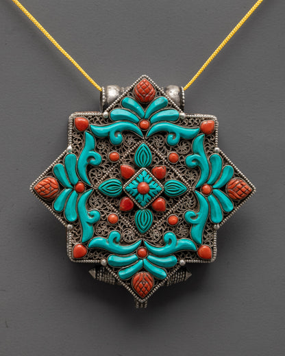 close up of tibetan locket silver filigree with coral and turquoise stones for protection