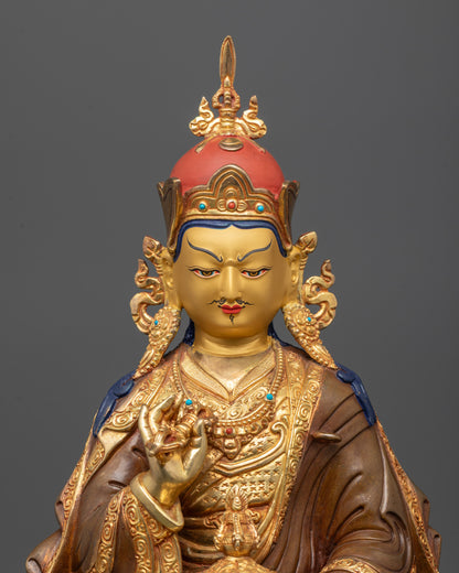 close up of tsokye dorje statue showing vajra khatvanga and semi precious stones