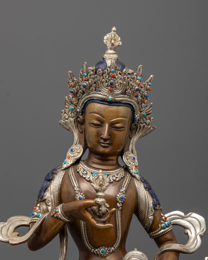 close up of vajrasattva face with silver-plated crown and embedded semi-precious stones
