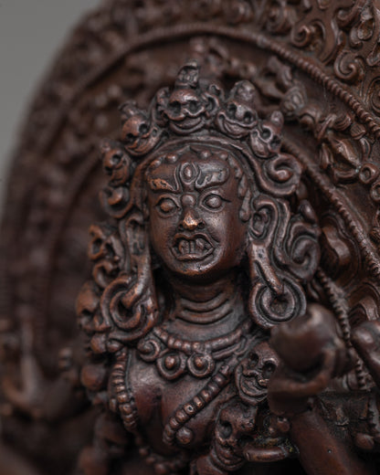 close up of wrathful face and Mundamala garland on machine-made oxidized Vajrayogini statue